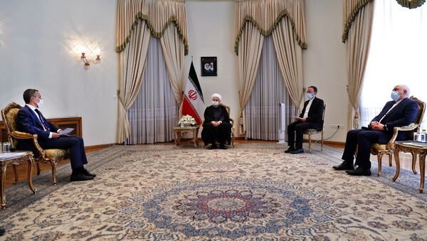 الرئيس الإيراني حسن روحاني خلال استقباله وزير خارجية سويسرا ايغناتسيو كاسيس في طهران - سبوتنيك عربي