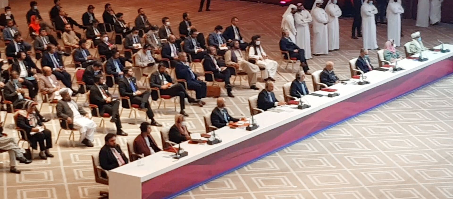 الجلسة الافتتاحية لمفاوضات السلام بين الحكومة الأفغانية وحركة طالبان، المنعقدة في الدوحة، قطر 12سبتمبر 2020 - سبوتنيك عربي, 1920, 18.03.2021