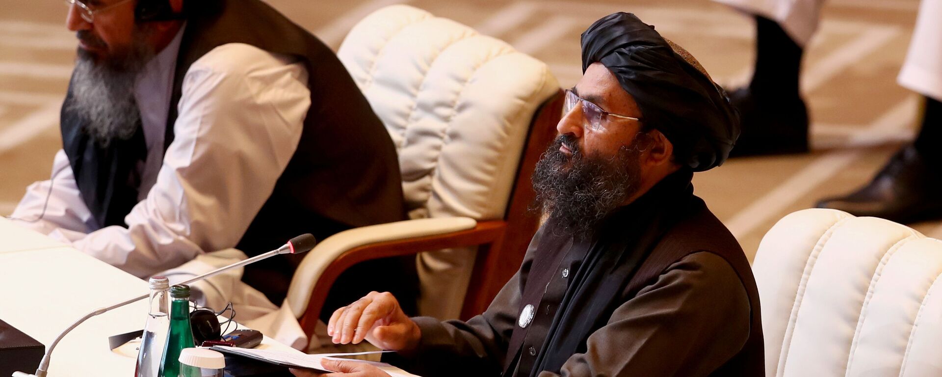 الملا عبد الغني بردار، رئيس وفد طالبان، خلال الجلسة الافتتاحية لمفاوضات السلام بين الحكومة الأفغانية وحركة طالبان، المنعقدة في الدوحة، قطر 12سبتمبر 2020 - سبوتنيك عربي, 1920, 23.04.2021