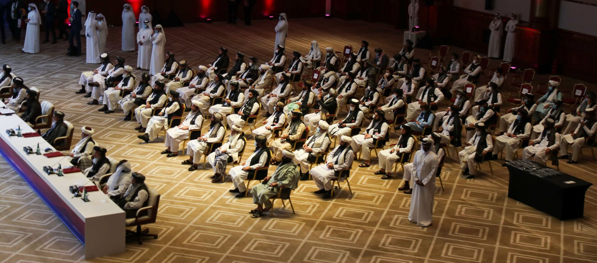الجلسة الافتتاحية لمفاوضات السلام بين الحكومة الأفغانية وحركة طالبان، المنعقدة في الدوحة، قطر 12سبتمبر 2020 - سبوتنيك عربي, 1920, 17.04.2021
