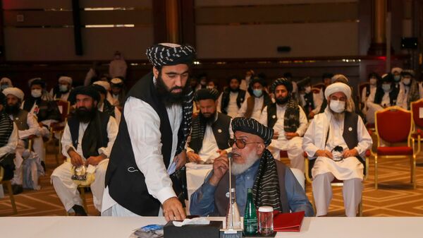 الجلسة الافتتاحية لمفاوضات السلام بين الحكومة الأفغانية وحركة طالبان، المنعقدة في الدوحة، قطر 12سبتمبر 2020 - سبوتنيك عربي