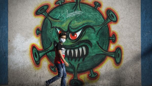 رسم غرافيتي توضيحي للوضع الوبائي في العالم ، فيروس كورونا - غزة، قطاع غزة، فلسطين 22 سبتمبر 2020 - سبوتنيك عربي