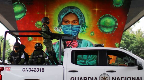 رسم غرافيتي توضيحي للوضع الوبائي في العالم ، فيروس كورونا - مدينة مكسيكو سيتي، المكسيك،  24 سبتمبر 2020 - سبوتنيك عربي