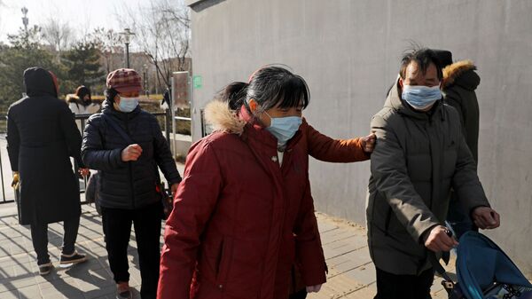 حملة الكشف عن فيروس كورونا واسعة النطاق في بكين، بسبب موجة جديدة لحالات الإصابة كوفيد-19 في الصين 11 يناير 2021 - سبوتنيك عربي