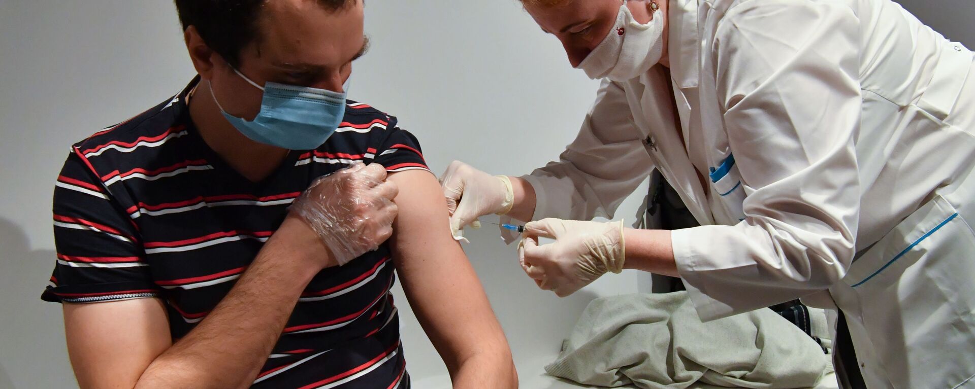 بدء حملة التطعيم واسعة النطاق بلقاح سبوتنيك V الروسي ضد فيروس كورونا في موسكو، روسيا، 18 يناير 2021 - سبوتنيك عربي, 1920, 10.03.2021