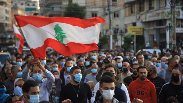 مظاهرات كبيرة من أجل إنقاذ لبنان وخلاص اللبنانيين في صيدا، لبنان مارس 2021 - سبوتنيك عربي