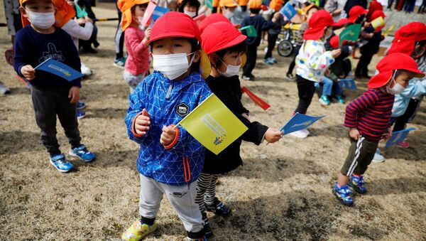 انطلاق مسيرة شعلة الأولمبياد دون احتفالات بسبب كورونا في اليابان، 25 مارس 2021 - سبوتنيك عربي