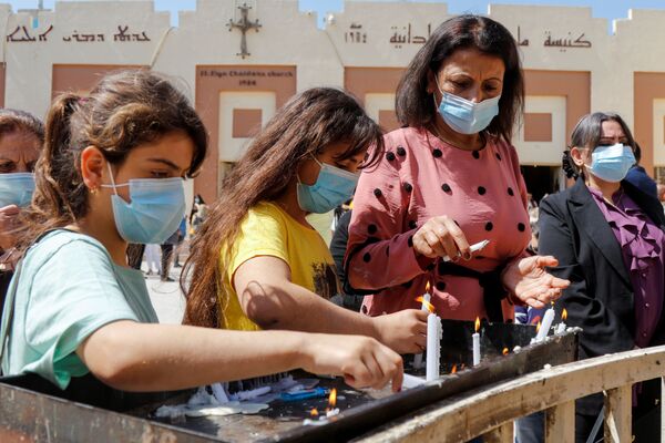 مراسم الاحتفال بعيد الفصح الكاثوليكي في بغداد، العراق 4 أبريل 2021 - سبوتنيك عربي