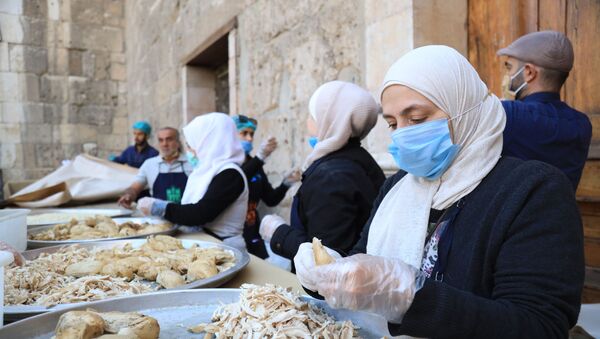 جمعيات مسيحية وإسلامية تقدم سكبة رمضان لصائمي دمشق، سوريا أبريل 2021 - سبوتنيك عربي