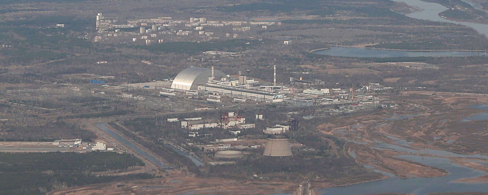 منظر يُظهر محطة تشيرنوبيل للطاقة النووية أثناء الجولة السياحية الجوية فوق منطقة تشيرنوبيل - سبوتنيك عربي, 1920, 26.02.2022