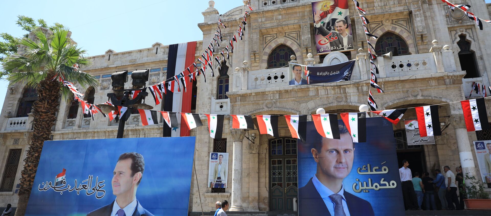 المواطنون السوريون يشاركون في التصويت في الانتخابات الرئاسية السورية في دمشق، سوريا 26 مايو 2021 - سبوتنيك عربي, 1920, 28.05.2021