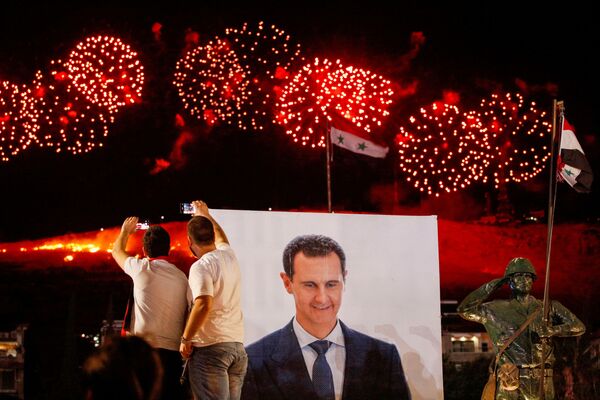 احتفالات في عموم سوريا بفوز الرئيس بشار الأسد في الانتخابات الرئاسية السورية، دمشق، سوريا 27 مايو 2021 - سبوتنيك عربي