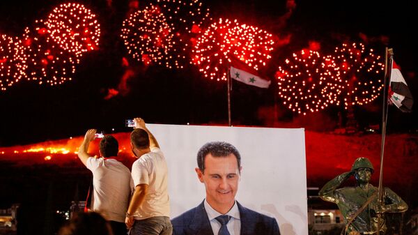 احتفالات في عموم سوريا بفوز الرئيس بشار الأسد في الانتخابات الرئاسية السورية، دمشق، سوريا 27 مايو 2021 - سبوتنيك عربي