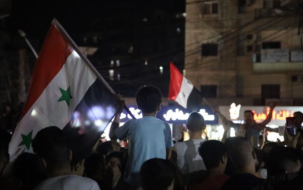 احتفالات في شوارع طرابلس بفوز بشار الأسد بالرئاسة السورية، لبنان 27 مايو 2021 - سبوتنيك عربي