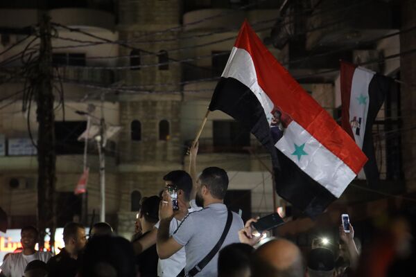 احتفالات في شوارع طرابلس بفوز بشار الأسد بالرئاسة السورية، لبنان 27 مايو 2021 - سبوتنيك عربي