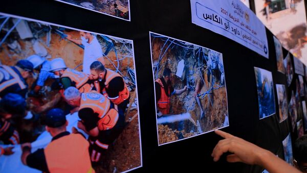 معرض شاهد على الجريمة يوثق مشاهد مؤثرة خلال الحرب الاخيرة على قطاع غزة - سبوتنيك عربي