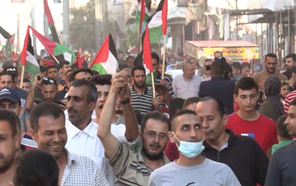 مسيرات حاشدة في قطاع غزة تنديدا بمسيرة الأعلام الإسرائيلية في القدس، فلسطين 16 يونيو 2021 - سبوتنيك عربي