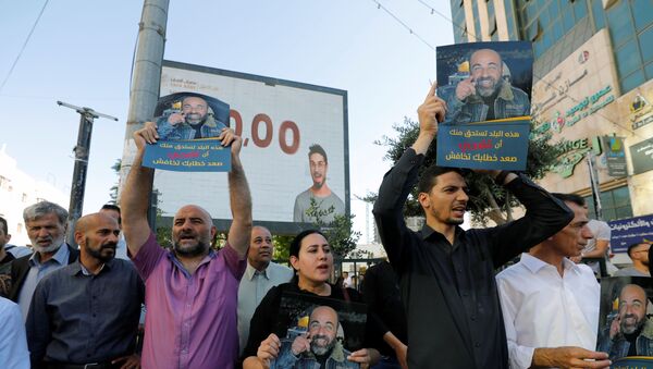 احتجاجات عارمة في الضفة الغربية ضد مقتل الناشط السياسي نزار بنات، الخليل، 27 يونيو 2021 - سبوتنيك عربي