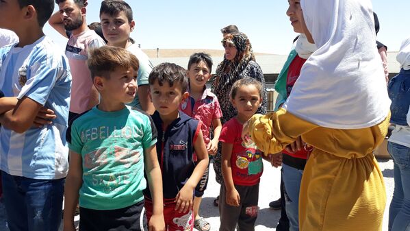 مساعدات من خانتي مانسيسك الروسي تصل منطقة حسياء الصناعية وسط سوريا، 29 يوليو 2021 - سبوتنيك عربي