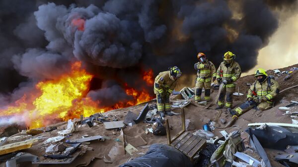 حريق هائل يلتهم 100 منزل في مدينة ايكويكو، تشيلي 10 يناير 2022 - سبوتنيك عربي