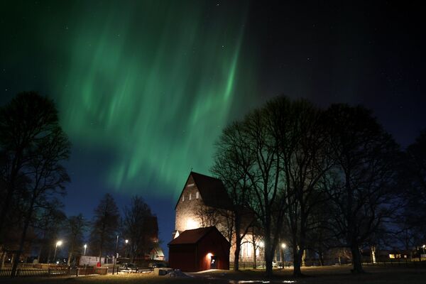 الشفق القطبي، والمعروف أيضا باسم أضواء الشمال، يضيء سماء أوبلاند، السويد، 17 يناير 2022. - سبوتنيك عربي
