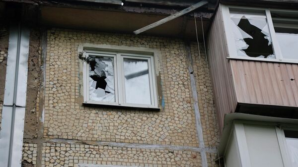 تداعيات قصف القوات المسلحة الأوكرانية في منطقة كويبيشيفسكي في دونيتسك، جمهورية دونيتسك الشعبية 22 مايو 2022 - سبوتنيك عربي