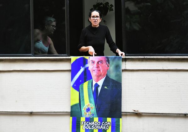 أحد أنصار الرئيس البرازيلي جايير بولسونارو يشارك في الاحتفالات بمناسبة الذكرى المئوية الثانية لاستقلال البرازيل، في شارع باوليستا ، في ساو باولو، البرازيل، في 7 سبتمبر 2022. - سبوتنيك عربي