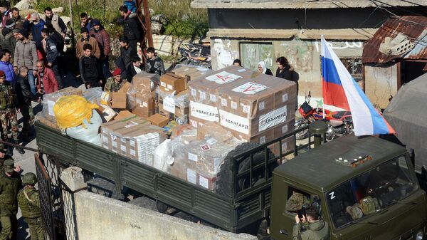 (جيش الشباب الروسي) يوزع مساعدات إغاثية على متضرري الزلزال بريف اللاذقية - سبوتنيك عربي