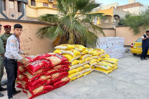 &quot;مفوضية الكشافة والمرشدات&quot; في مدينة طبرق الليبية، تقدم مساعدات لأهالي مدينة درنة، الناجين من الإعصار. - سبوتنيك عربي