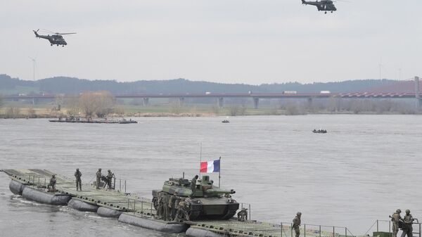 القوات المسلحة البولندية وأخرى مشاركة خلال مناورة عسكرية التنين-24، وهي جزء من مناورات المدافع الصامد 2024، التابعة لحلف الناتو في كورزينيوو، شمال بولندا، في 4 مارس 2024. - سبوتنيك عربي