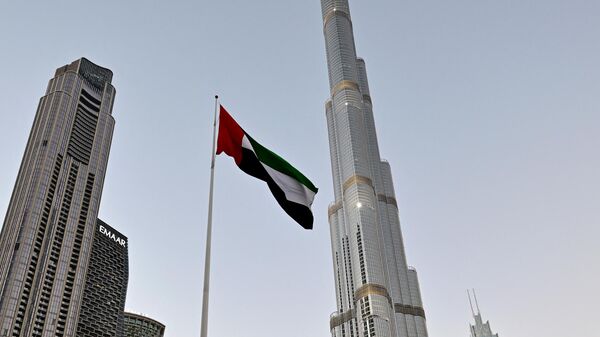 غروب الشمس بالقرب من برج خليفة في وسط دبي في 12 مارس 2024 - سبوتنيك عربي