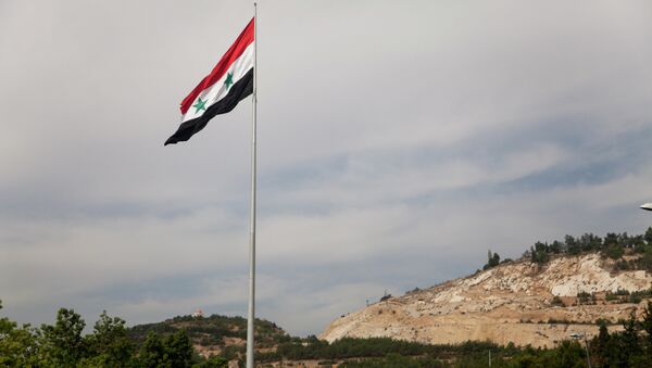 Syrian flag over the capital, Damascus, Syria - سبوتنيك عربي