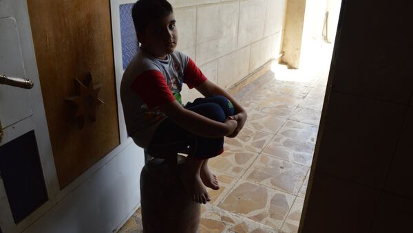 طفل عراقي في حوزة تنظيم داعش لتهيئته ليصبح قنبلة بشرية - سبوتنيك عربي