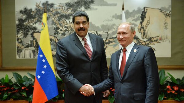 بوتين مع نظيره الفنزويلي نيكولاس مادورو - سبوتنيك عربي