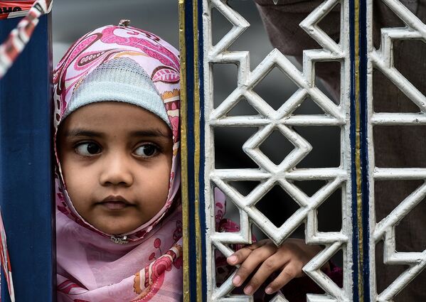 فتاة مسلمة خلال عيد الأضحى المبارك في ماليزيا - سبوتنيك عربي