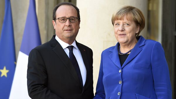 المستشارة الألمانية أنجيلا ميركل والرئيس الفرنسي فرانسوا هولاند - سبوتنيك عربي