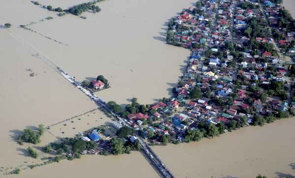 صورة من الجو لمدينة غرقت بعد فيضان كوبو في الفلبين. - سبوتنيك عربي