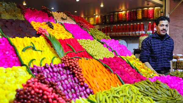 Stand offering various sourts of pickeled and colored vegetables at a covered street market in central Damascus - سبوتنيك عربي