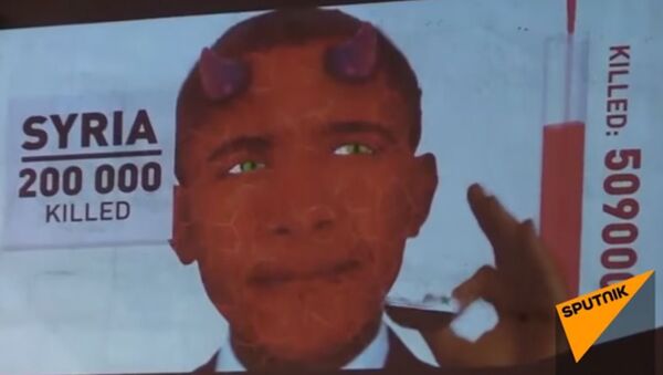 أوباما الشيطان يأكل علم سوريا وليبيا والعراق - سبوتنيك عربي