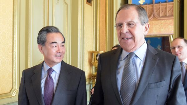 وزيرا الخارجية الروسي والصيني سيرغي لافروف ووانغ يي - سبوتنيك عربي