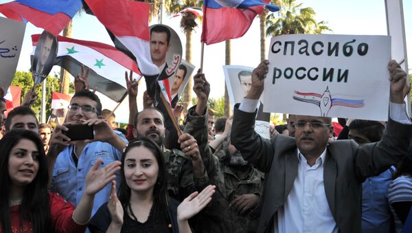 مظاهرة في مدينة طرطوس لمساندة العملية العسكرية الروسية في سوريا. - سبوتنيك عربي