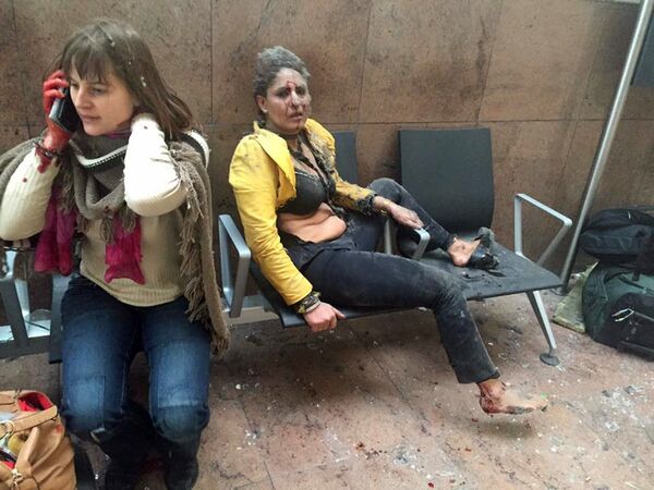 ضحايا تفجيرات المطار في بروكسل، بلجيكا، 22 مارس/ آذار 2016. - سبوتنيك عربي