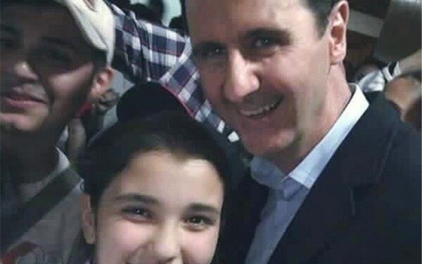 صورة مع الرئيس السوري بشار الأسد - سبوتنيك عربي