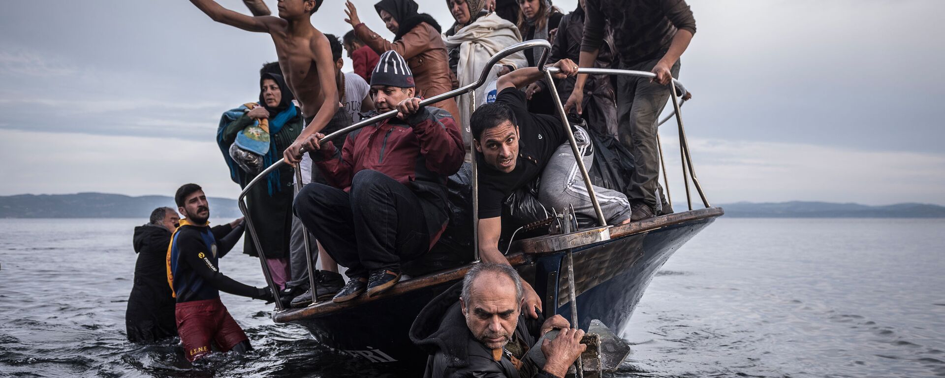 وصول مهاجرين من سوريا إلى جزيرة يونانية - سبوتنيك عربي, 1920, 12.10.2021
