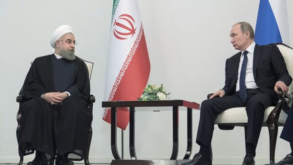الرئيسين الروسي فلاديمير بوتين والإيراني حسن روحاني (ارشيفية) - سبوتنيك عربي