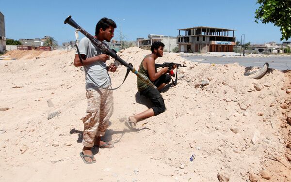 ليبيا - أفراد القوات الليبية خلال تواجدهم في مواقع المواجهة ضد تنظيم داعش في مدينة سرت، 15 أغسطس/ آب 2016 - سبوتنيك عربي
