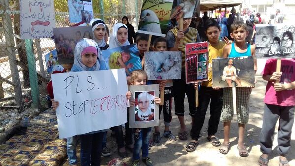 اعتصام من أجل فك الحصار عن بلدتي الفوعة وكفريا وإنقاذ المدنيين فيهما - سبوتنيك عربي