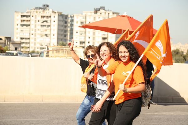 لعونيون يحيون ذكرى تشرين لعونيون يحيون ذكرى تشرين - سبوتنيك عربي