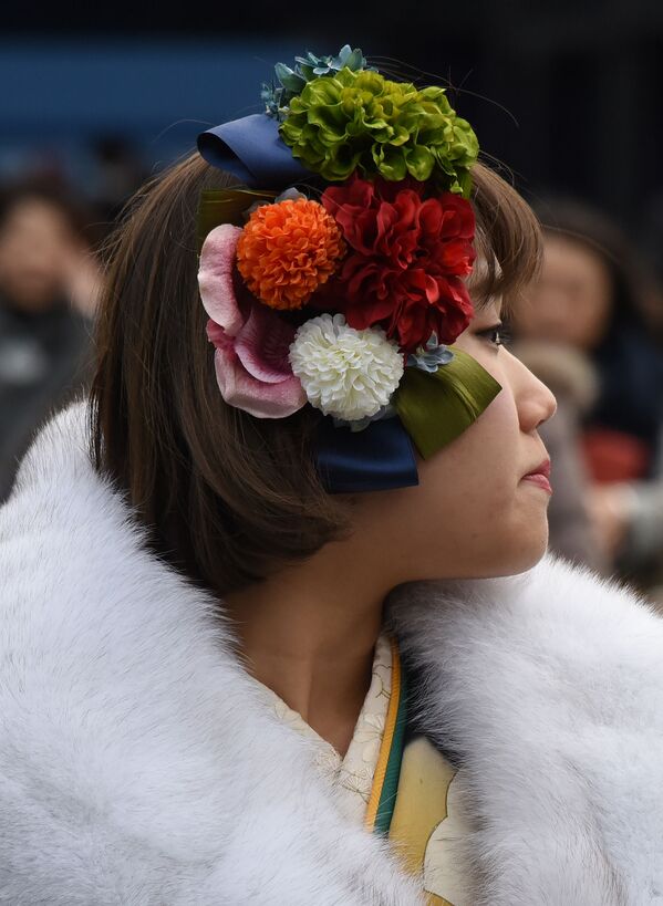 فتاة يابانية في حديقة ديزني لاند في يورياسو، اليابان 9 يناير/ كانون الثاني 2017 - سبوتنيك عربي