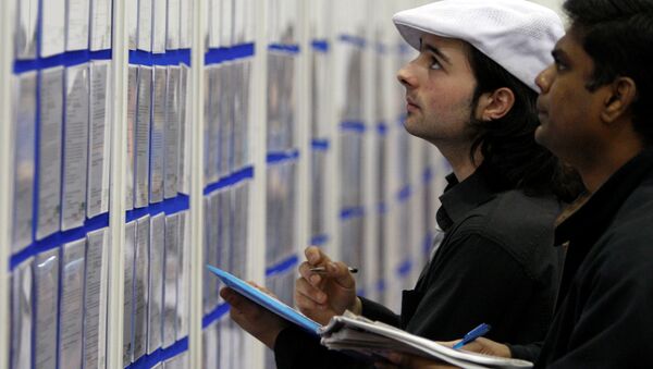 People look at job listings at the Careers and Jobs Live careers fair at the ExCeL centre in London (File) - سبوتنيك عربي